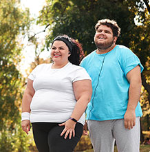 healthy couple after successful weight management treatment